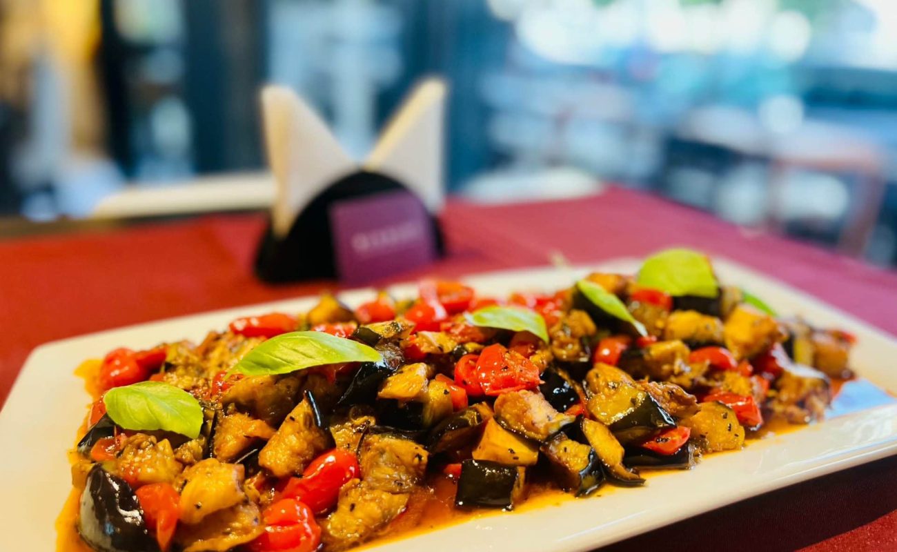 Mushroomed aubergines with cherry tomatoes, a local delicacy.